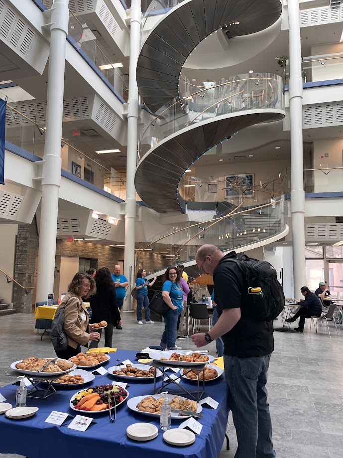 Attendees grabbing food in the BBB atrium